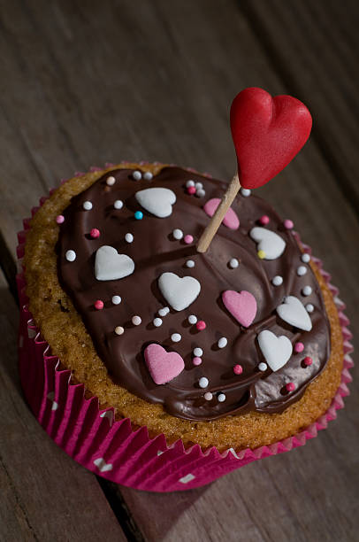 istock Delicious cupcake with sugar hearts 505674544