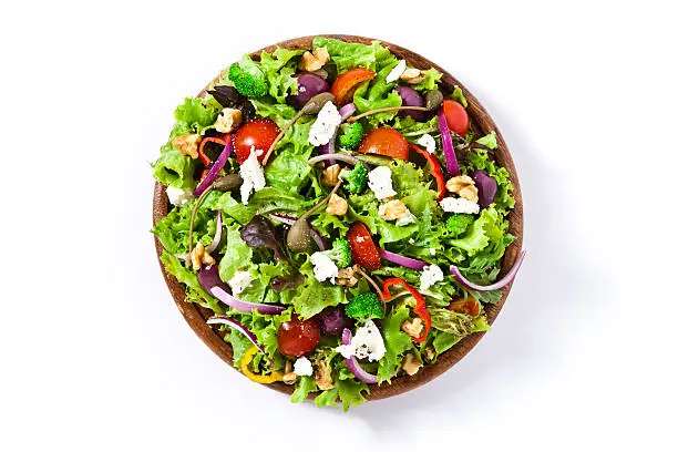 Photo of Spring salad shot from above on white background