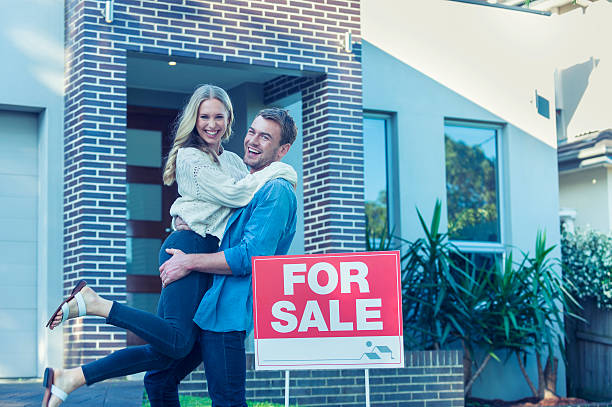 istock Couple in front of a new home. 505684862