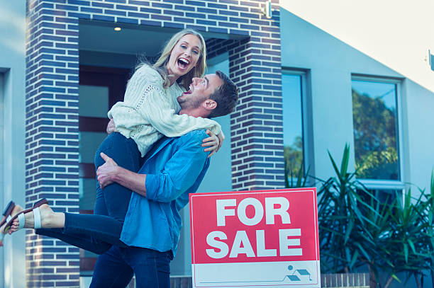 istock Couple in front of a new home. 505685002