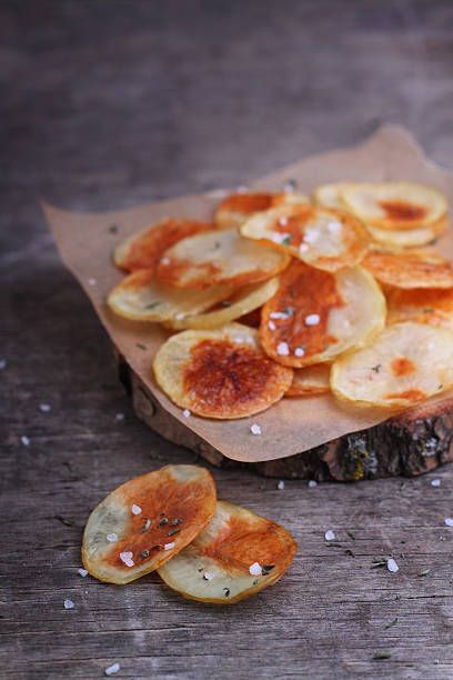 istock homemade potato chips with sea salt 505685634