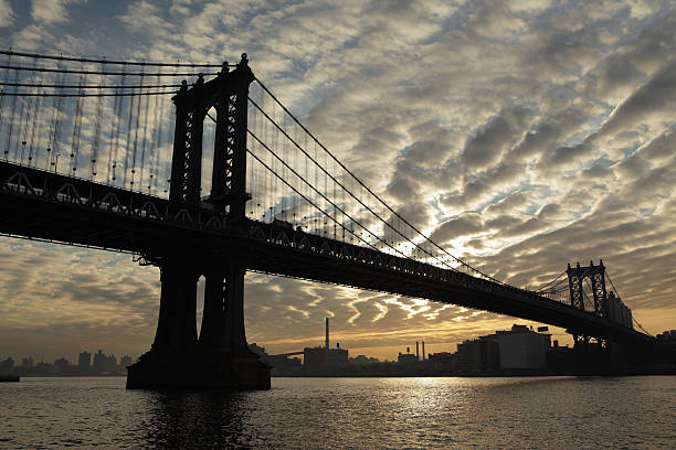 istock Manhattan Bridge and East River industrial sunrise 505686124
