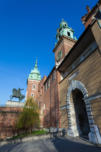 Krakow, Poland - April 22, 2015. Main entrance to Royal Wawel Castle in Krakow. Kosciuszko sculpture invites tourists wants to visit Castle.