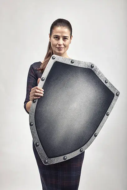 Woman protecting herself with a shield