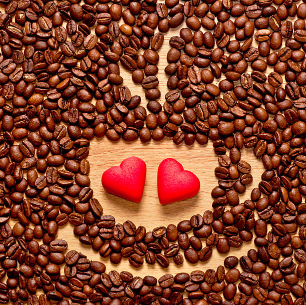 coffee beans cup and two heart stock photo
