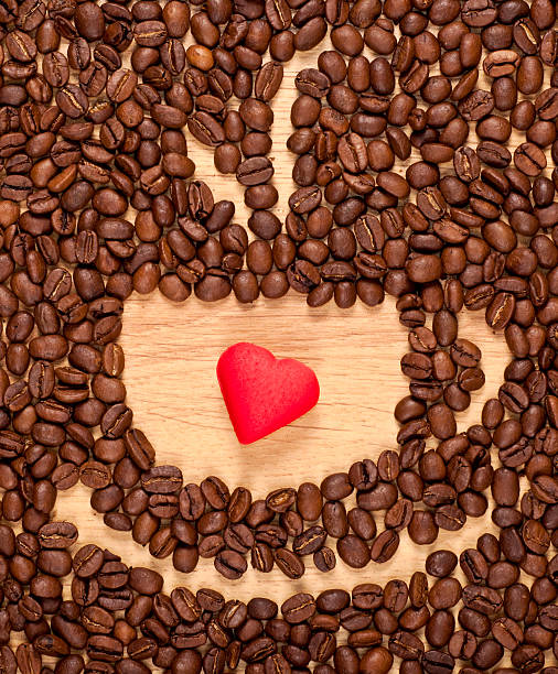 coffee beans cup and red heart stock photo