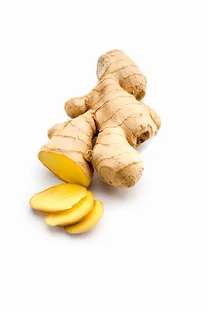 Cut Ginger root isolated on white background.