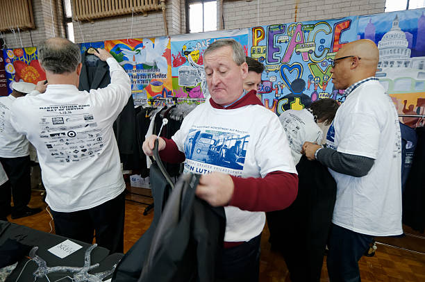 Philadelphia Mayor Jim Kenney volunteers for MLK Day of Service Philadelphia, PA, USA - January 18, 2016; Philadelphia Mayor Jim Kenney, joined by other elected officials, community members volunteers at a gently used business attire sorting project during the 21st Martin Luther King Day of Service in Philadelphia, PA. martin luther king jr day stock pictures, royalty-free photos & images