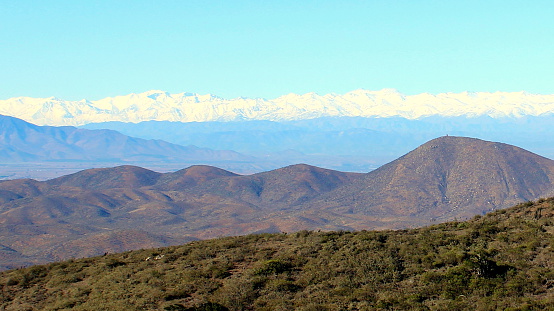 Landscape from FJNP showing the andean mountains and different colored hills.