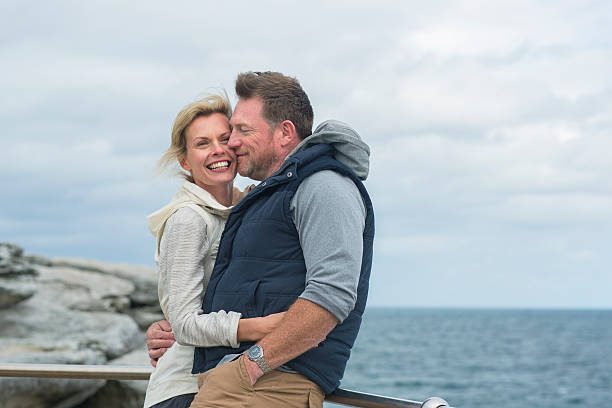 istock Happy couple by the beach 505692194