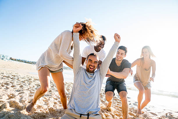 istock Group of friends having fun at the beach 505692770