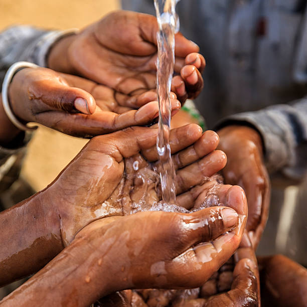 istock Poor Indian children asking for fresh water, India 505693628