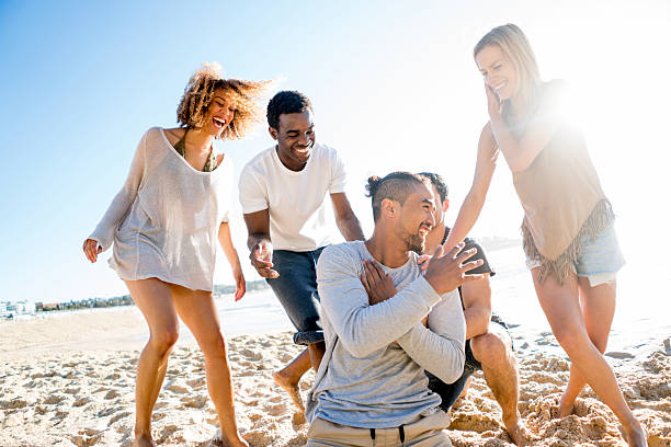istock Friends enjoying the summer outdoors at the beach 505693740
