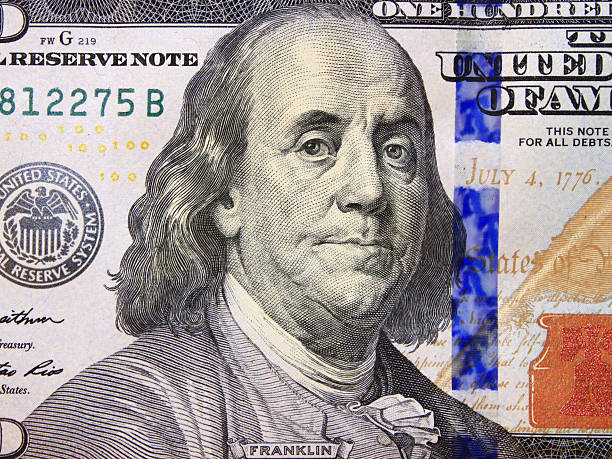 istock hundred dollar bank note with image of president Franklin 505694126