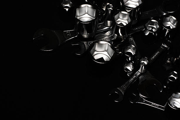 istock Set of chrome wrenches on black background. Close up. 505695312