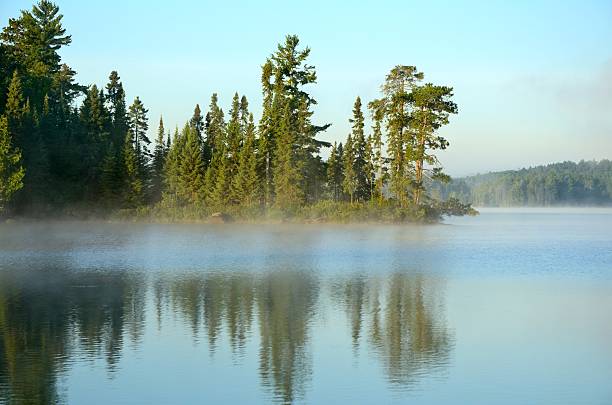 istock Reflections on a Foggy Wilderness Lake 505695674