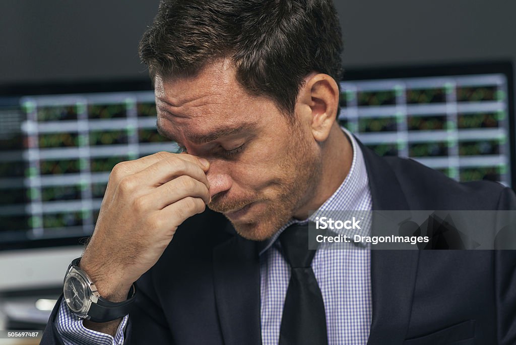 Tired stock market trader Close-up portrait of tired stock market trader Adult Stock Photo Tired stock market trader Close-up portrait of tired stock market trader Adult Stock Photo