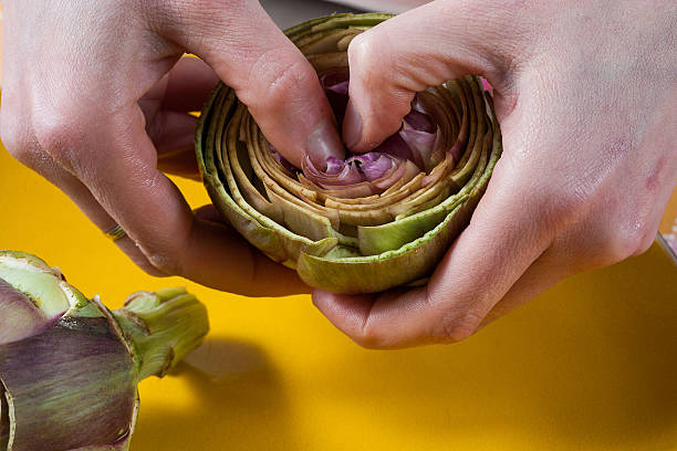 istock Preparing Jewish artichokes 505697845