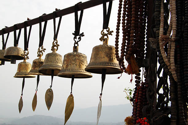 Wind chime bells for sale at the Monkey Temple in Kathmandu. The Swayambhunath Temple is an ancient Buddhist complex situated on a hill overlooking Kathmandu. Famous for its holy monkeys, it is also known as the Monkey Temple. Built in the 5th Century, it is one of the oldest temples in Nepal.