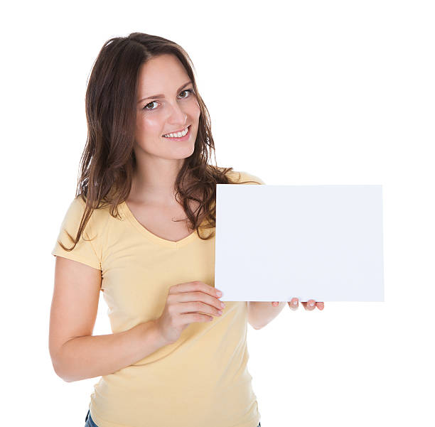 istock Smiling Woman Holding Placard 505698281