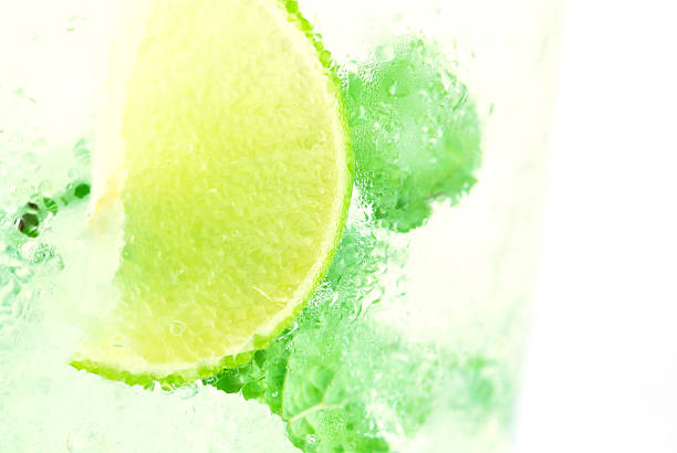 istock Mojito , lime pieces , leaves of mint with ice and rum 505698595