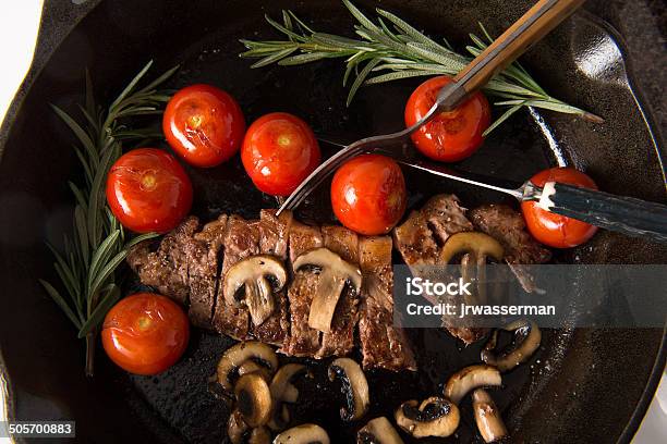 Grilling Strip Loin Steak Series The Steak Is Sliced Stock Photo - Download Image Now