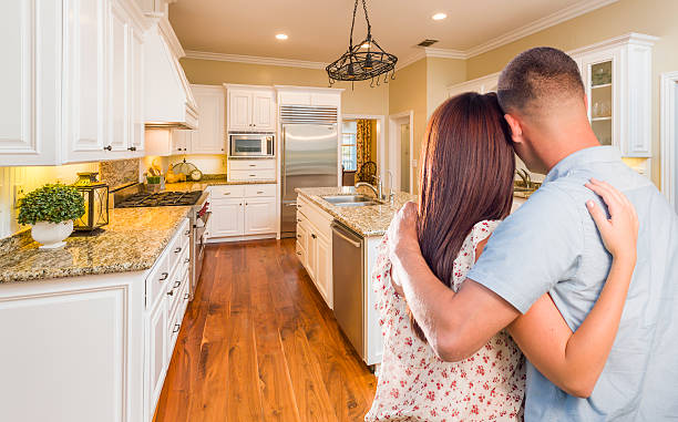 istock Young Hopeful Military Couple Looking At Custom Kitchen 505712146