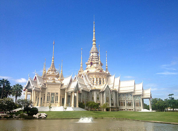 istock White temple on blue sky day 505712544