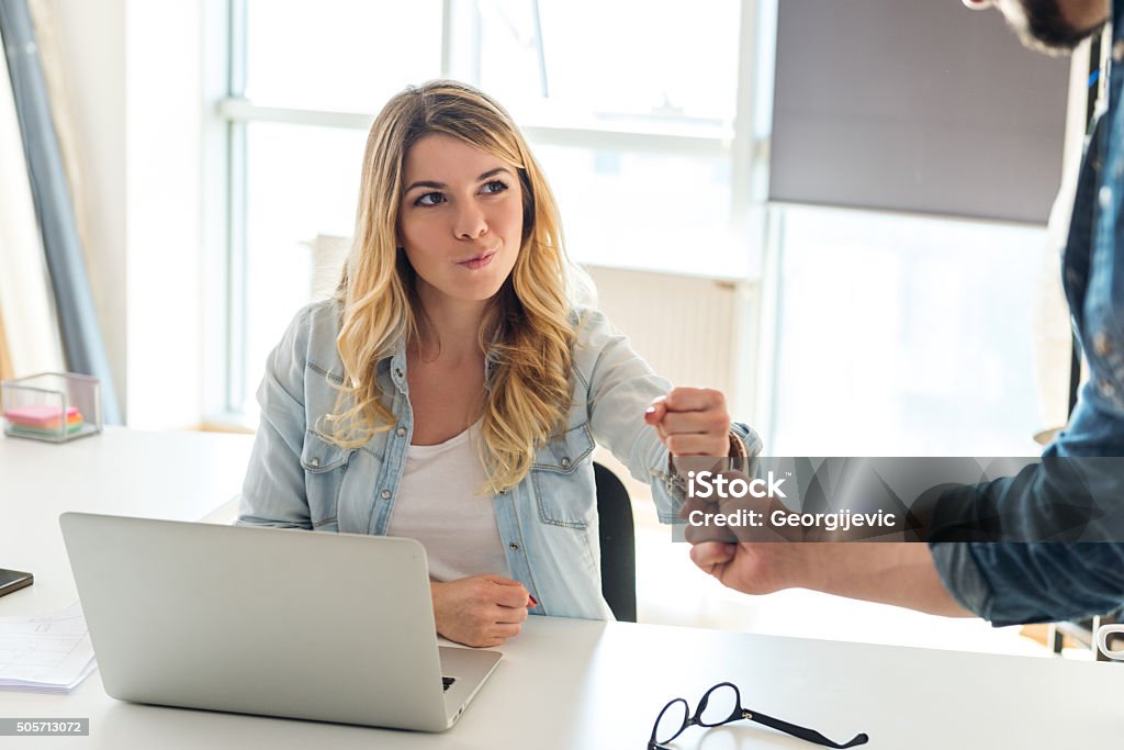 We have a deal! Happy business couple making a deal about work. Celebration Stock Photo