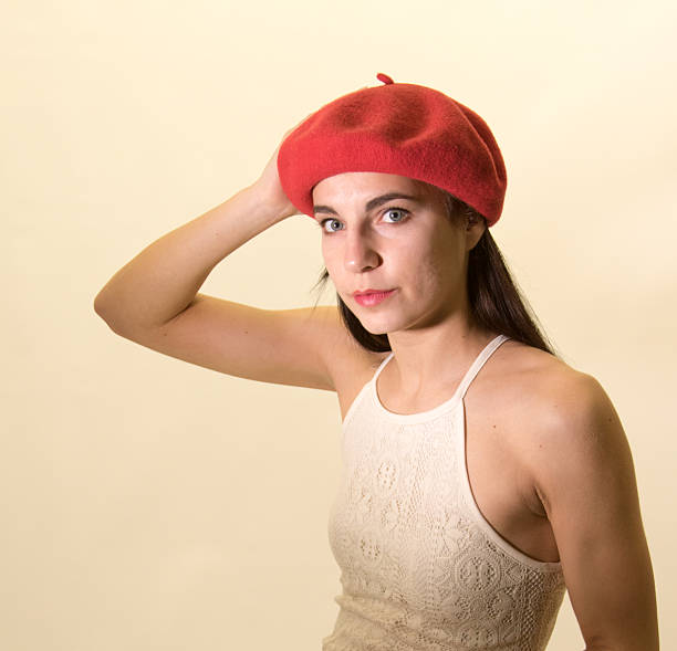 istock Young Adult Female Adjusting Her Beret 505713632