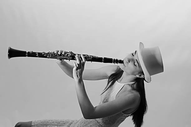 This young adult female clarinetist is shown in black and white