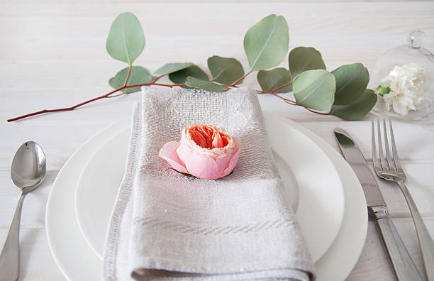 istock Decorated table setting with linen napkins, rose and white carnation 505715322
