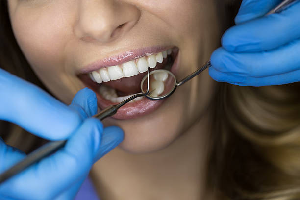 istock Dentist examining a patient's teeth in the dentist 505715908
