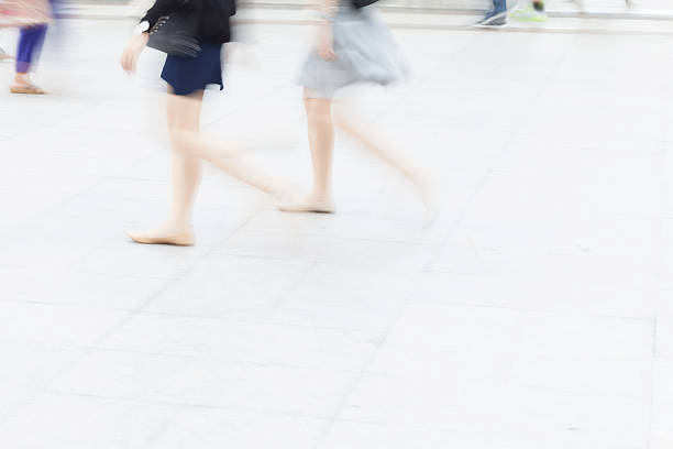 istock motion blur business people walking 505716012