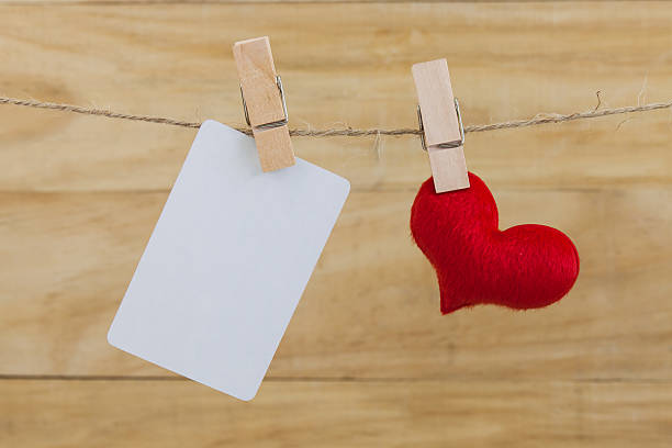 istock Blank note and red hearts hanging on rope 505717876