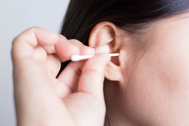 istock Woman Picking Her Ear 505719480