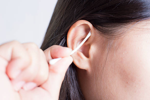 istock Woman Picking Her Ear 505719572