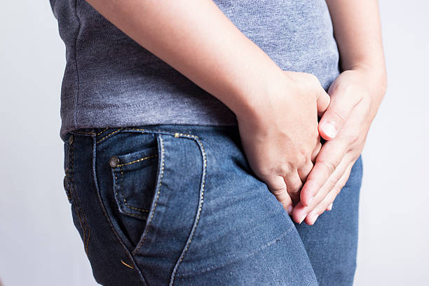 istock Woman with Hands Holding her Crotch 505720230