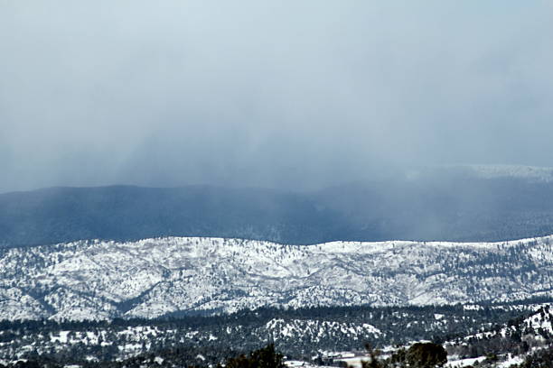 istock Snowing on snowy hills 505720484
