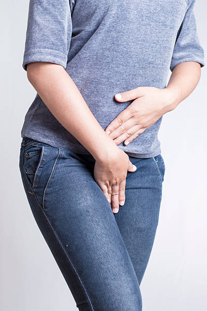 istock Woman with Hands Holding her Crotch 505721380
