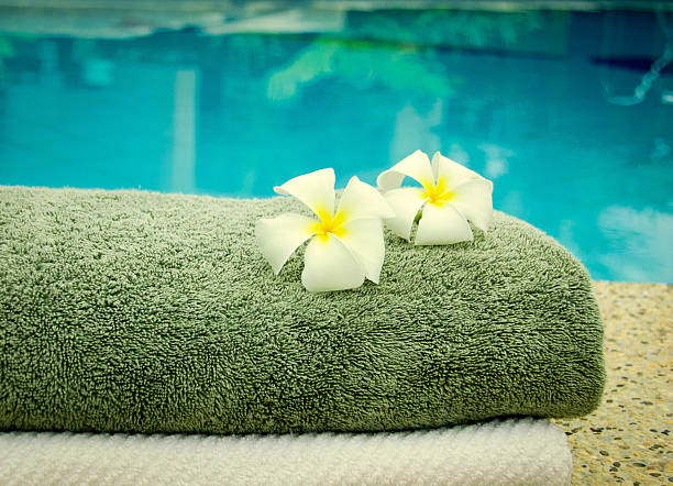 istock spa towels near the swiming pool 505721855