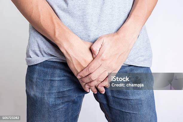 Man Covering His Crotch Isolated Background Stock Photo - Download Image Now - Men, Hiding, Penis