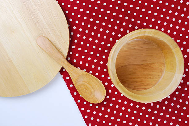 istock Wooden bowl, tablecloth, spoon, fork on table background 505723409