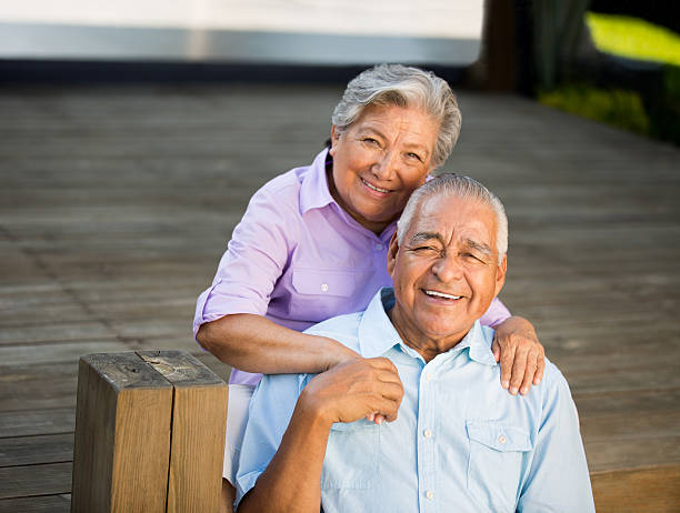 istock Senior couple sitting on deck 505726595