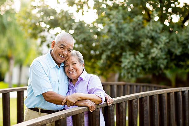 istock Latin senior couple posing on bridge 505726597