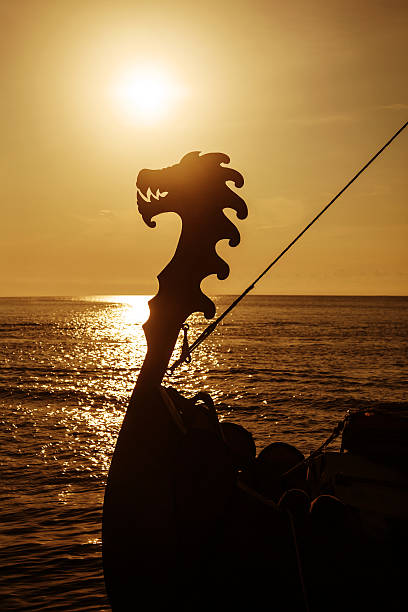 Drakkar Viking drakkar at open sea at sunset viking ship photos stock pictures, royalty-free photos & images