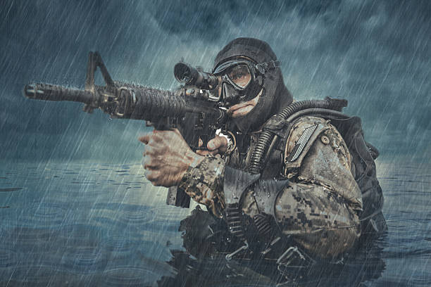 Navy SEAL frogman Navy SEAL frogman with complete diving gear and weapons in the water  special forces photos stock pictures, royalty-free photos & images