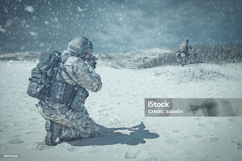 Troopers winter storm Two soldiers in actiorn through the snowstorm Snow Stock Photo