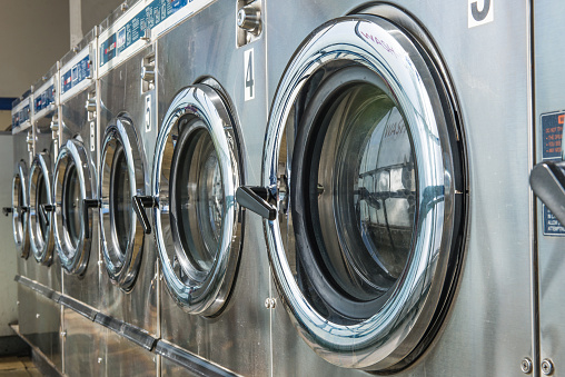 industrial laundry machines in laundrette