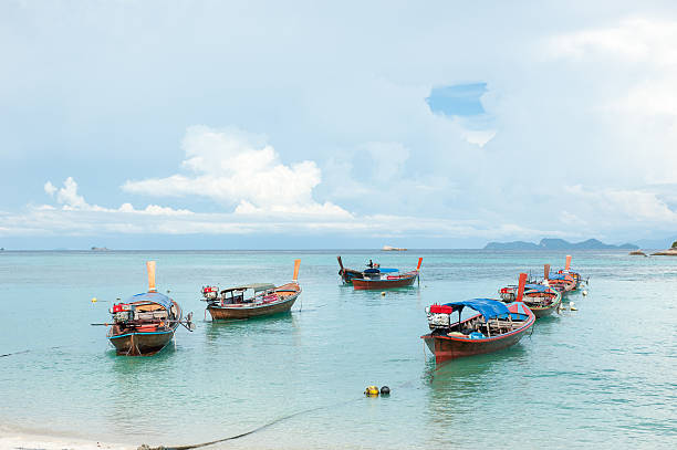 istock Boat on the beach at sunrise time 505746326
